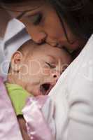 Attractive Ethnic Woman with Her Yawning Newborn Baby