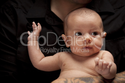 Young Father Holding His Mixed Race Newborn Baby