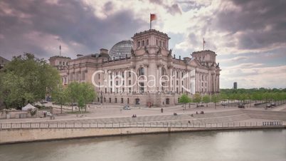 The Reichstag Building Berlin (Bundestag) in 1080p FullHD Timelapse with cloud dynamic, famous landmark in Berlin, Germany and housing the German goverment