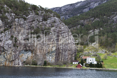 some houses under big rock