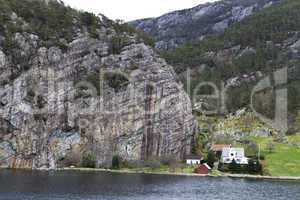 some houses under big rock