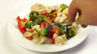 Eating Chicken and Vegetable Stir Fry
