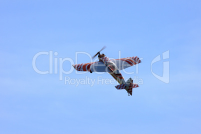 RC model airplane flying in the blue sky