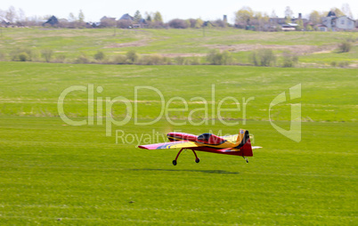 RC model airplane lands on the grass
