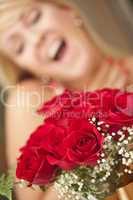 Blonde Woman Accepts Gift of Red Roses
