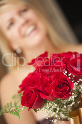 Blonde Woman Accepts Gift of Red Roses