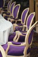 Luxurious Purple Chairs in Formal Dining Room.