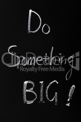 Chalk writing of Do something BIG
