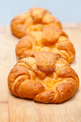 fresh baked french croissant brioche on wood board