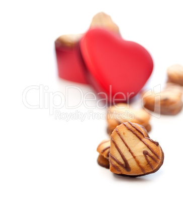 heart shaped cream cookies on red heart metal box