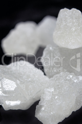 pieces of rock sugar crystal over black