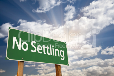No Settling Green Road Sign and Clouds