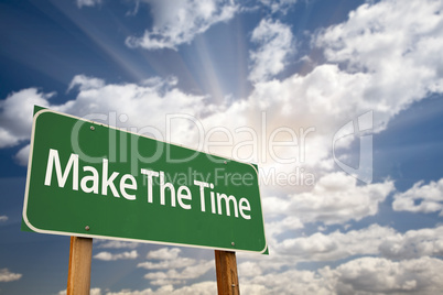 Make The Time Green Road Sign and Clouds