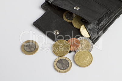 loose cash falling out of black wallet