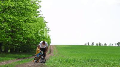 Child Learn To Ride A Bike