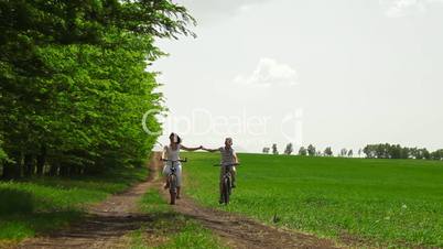 Family Cycling In The Summer Time