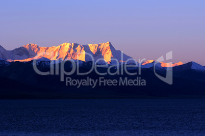 Landscape of snow-capped mountains at lakeside