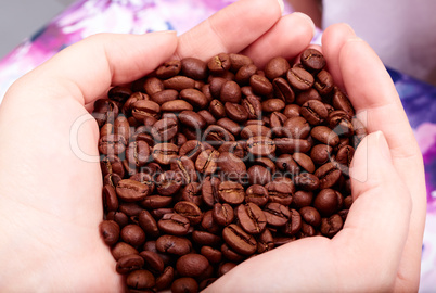 Coffee beans in hands