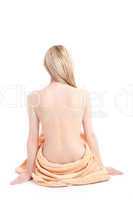 Schöner weiblicher Rücken mit einem Handtuch um die Hüfte