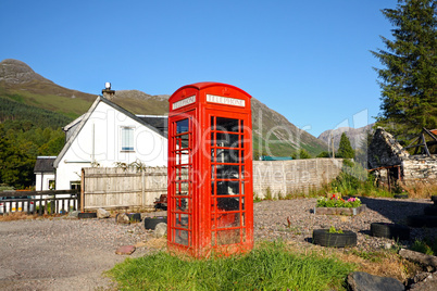 Old, British, red phonebox in the Scottish village.