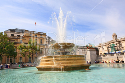 Trafalgar Square with the fountain and tourists, London, UK