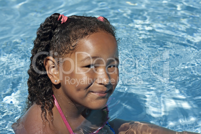 Young black girl in swimming pool