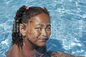 Young black girl in swimming pool