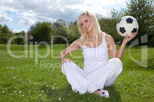 Smiling woman about to throw a football