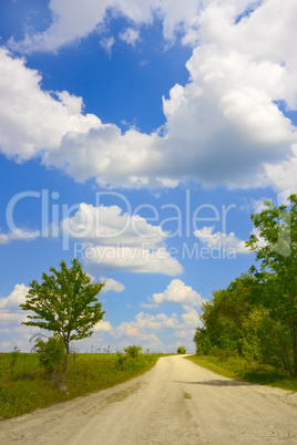 Cloudscape over rural road