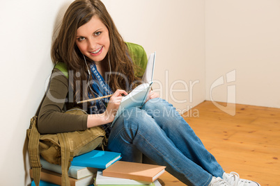 Student teenager woman hold book listen music