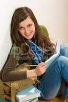 Student teenager woman hold book listen music