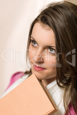 Young student girl with book pink clothes