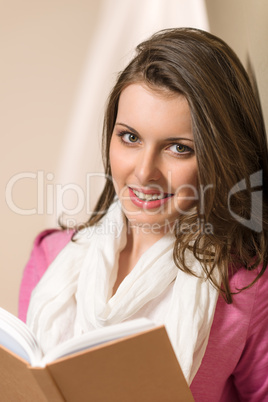 Beautiful young woman student hold book