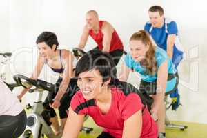 Fitness group of people on gym bike