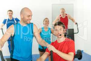 Young fitness instructor lead class alpinning