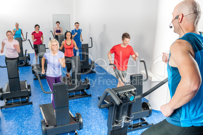 Class of young adults with fitness trainer