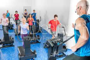 Class of young adults with fitness trainer