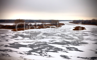 Winter landscape: the river, coast, trees