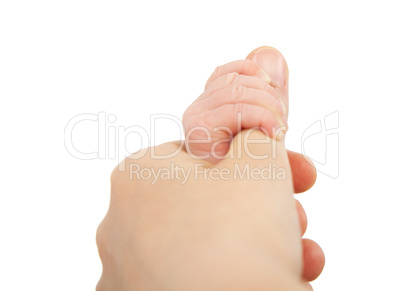 baby hand holding mother finger