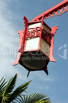 Red lantern against blue sky