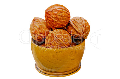 Walnuts from juniper wood in a vase