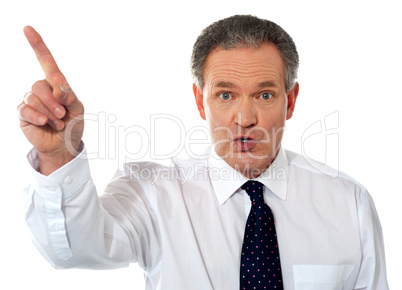 Businessman pointing at copy space