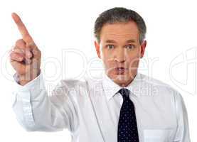 Businessman pointing at copy space