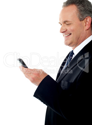 Business executive reading text sms