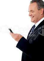 Business executive reading text sms