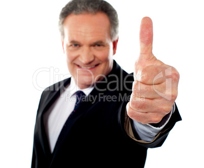 Successful entrepreneur gesturing thumbs-up