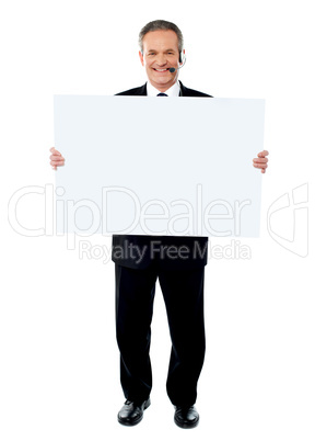 Businessman holding a blank billboard