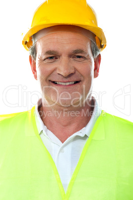 Smiling senior builder wearing hardhat