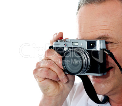 Cropped image of aged male photographer