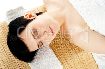 Closeup of a gorgeous girl relaxing at spa